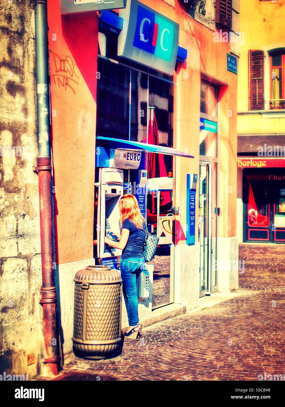 Woman at atm - Smartphone Captured Stock Image