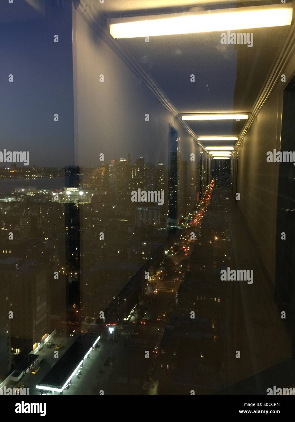 Hallway reflection on the window looking out to Manhattan streets Stock ...