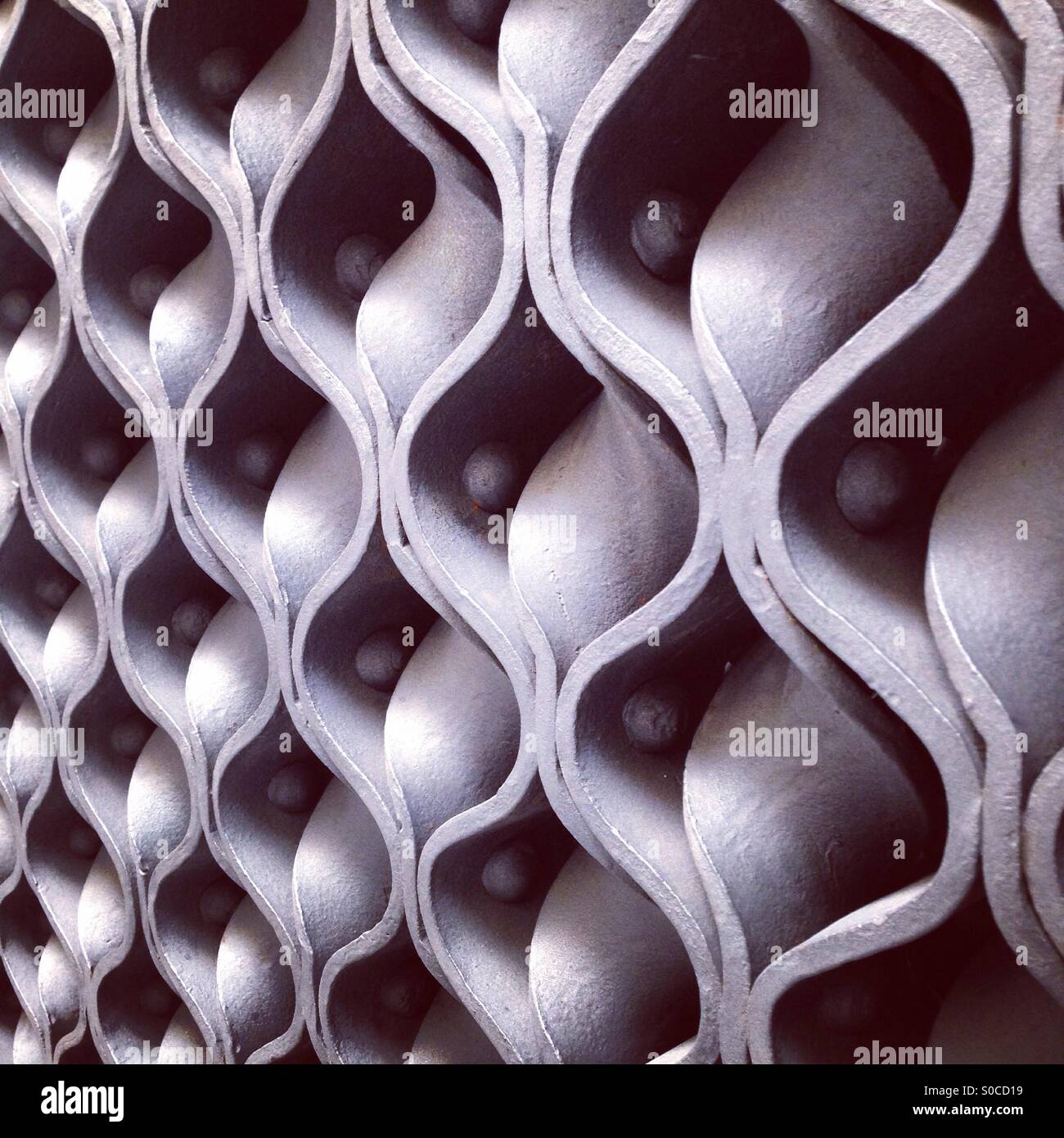Detail from the wrought iron door at the entrance to Guell Palace, Barcelona. Designed by Antoni Gaudi. - Smartphone Captured Stock Image