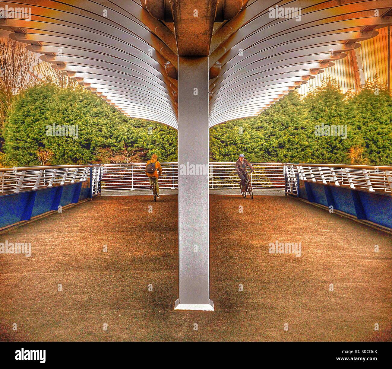 Two cyclists on Bells Bridge, Glasgow - Smartphone Captured Stock Image