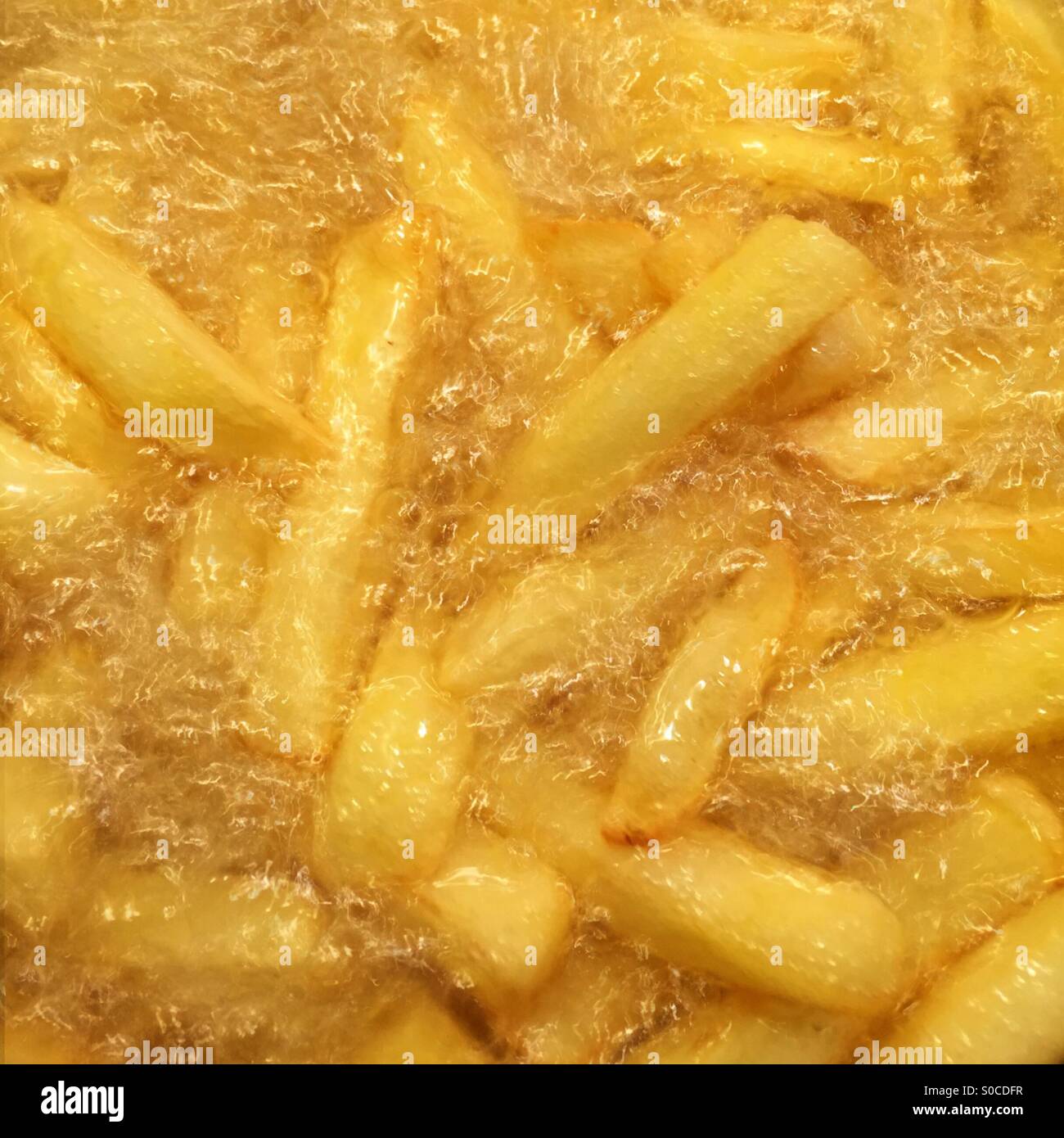 French fries frying - Smartphone Captured Stock Image