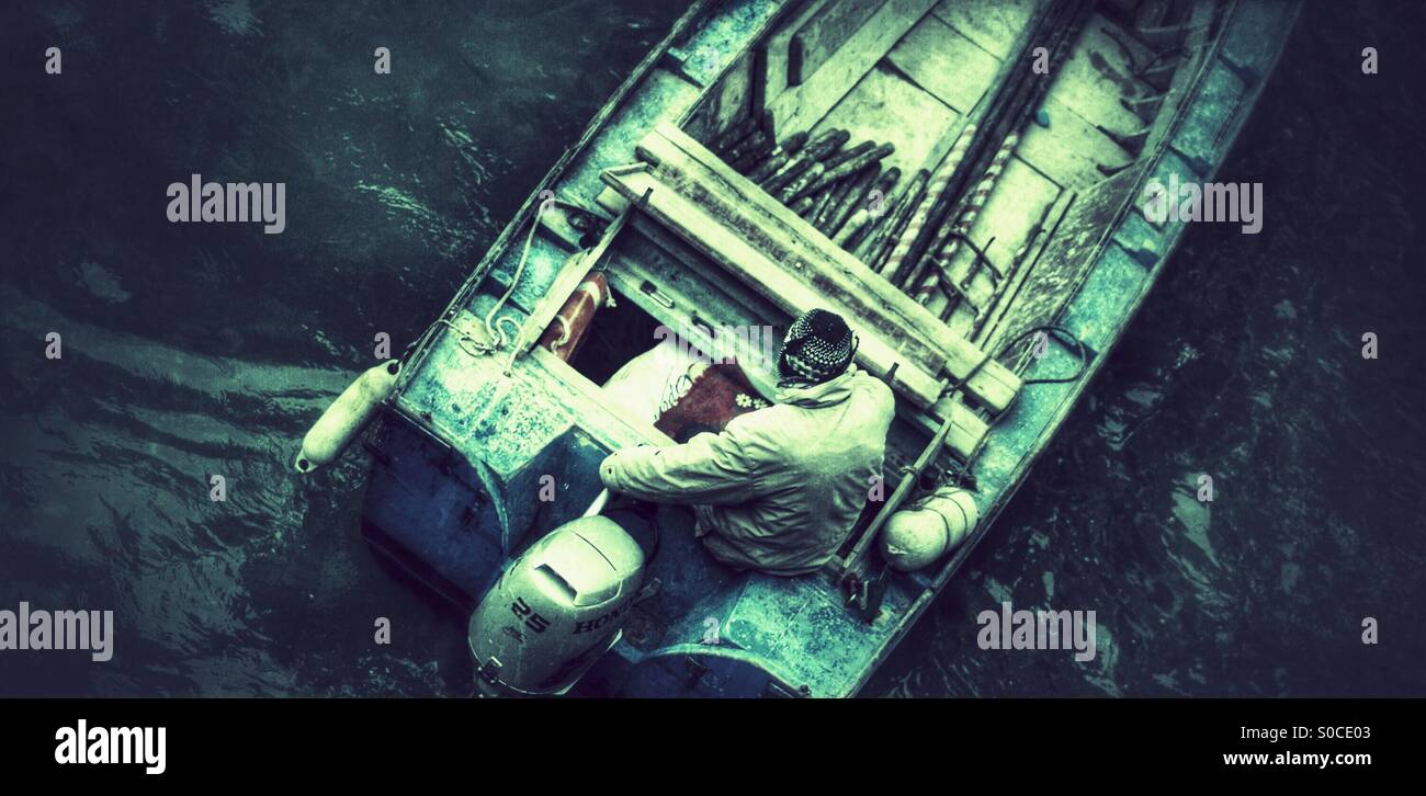 Man in boat from above pow - Smartphone Captured Stock Image