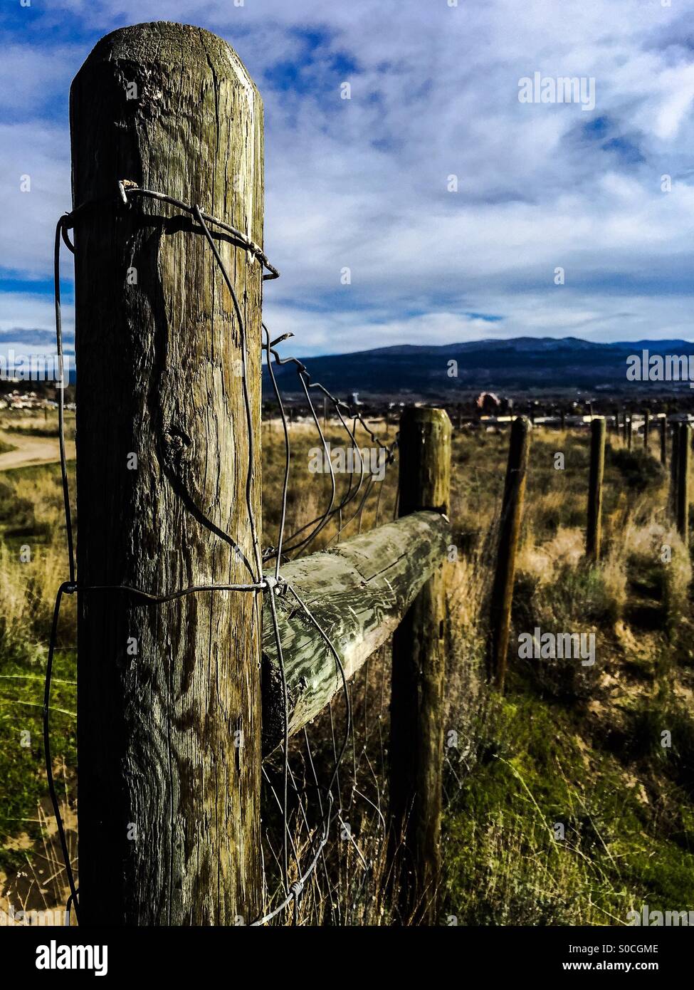 Wooden fence with wire on it. - Smartphone Captured Stock Image