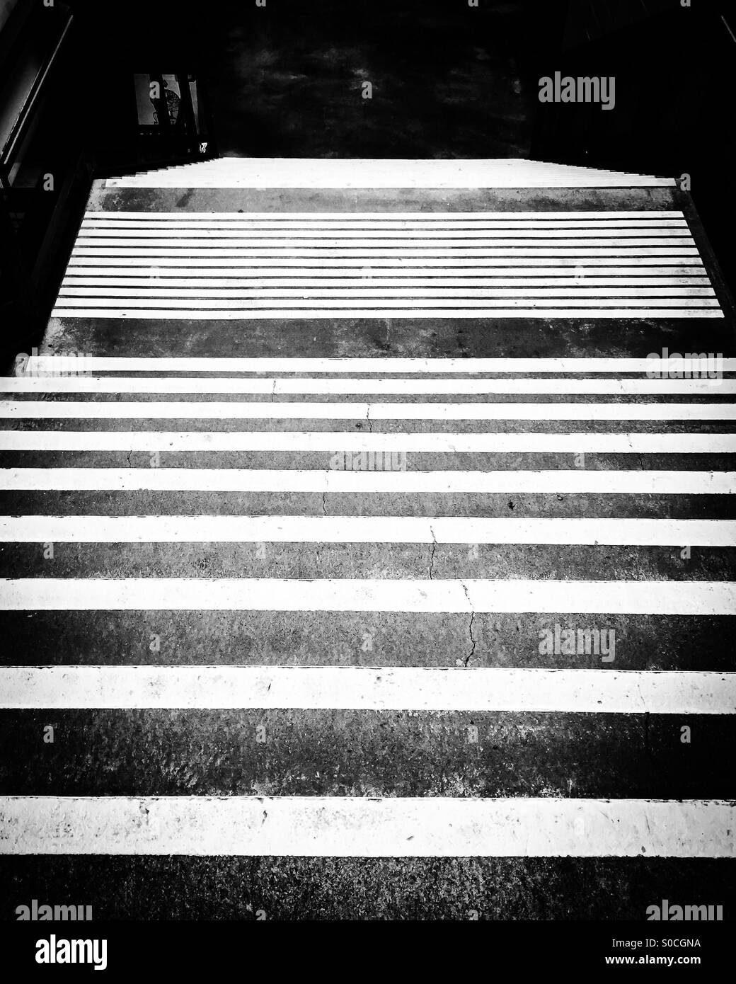 Concrete stairs at sports arena in black and white. Looking down. - Smartphone Captured Stock Image