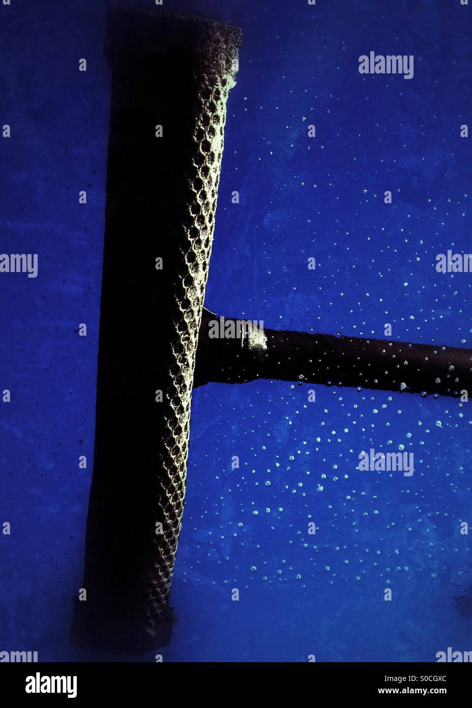 Washing the car windshield - Smartphone Captured Stock Image