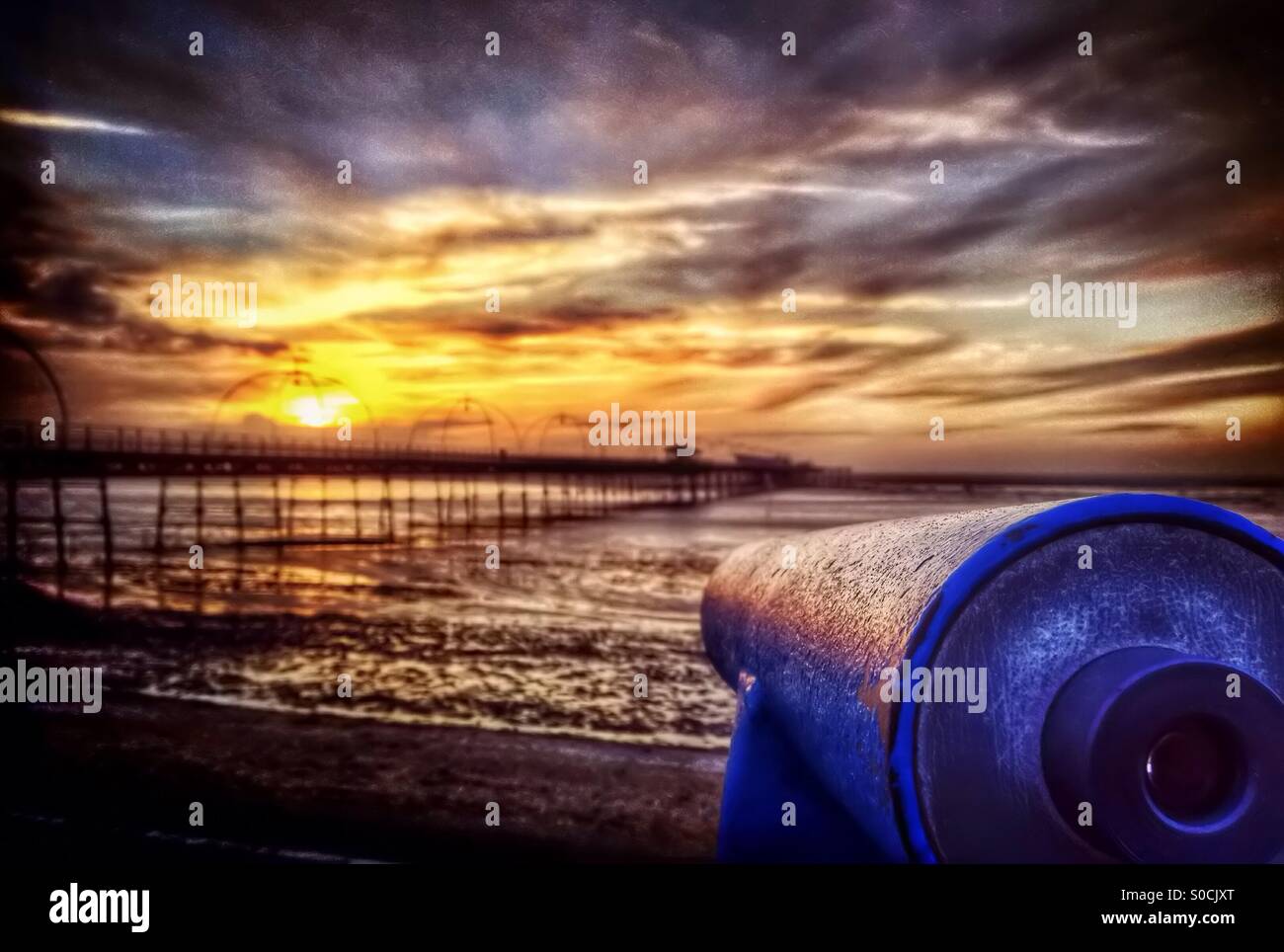 Telescope pointing at Southport pier at sunset - Smartphone Captured Stock Image