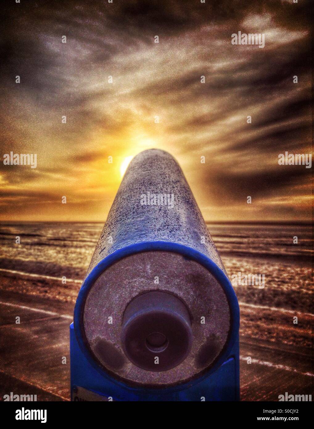 Telescope pointing at sun at sunset - Smartphone Captured Stock Image