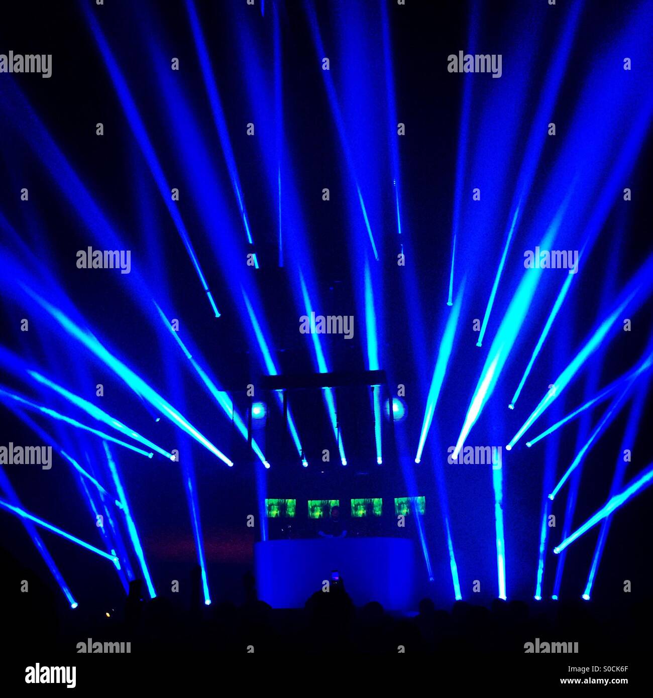 Blue laser light display at a music concert Stock Photo