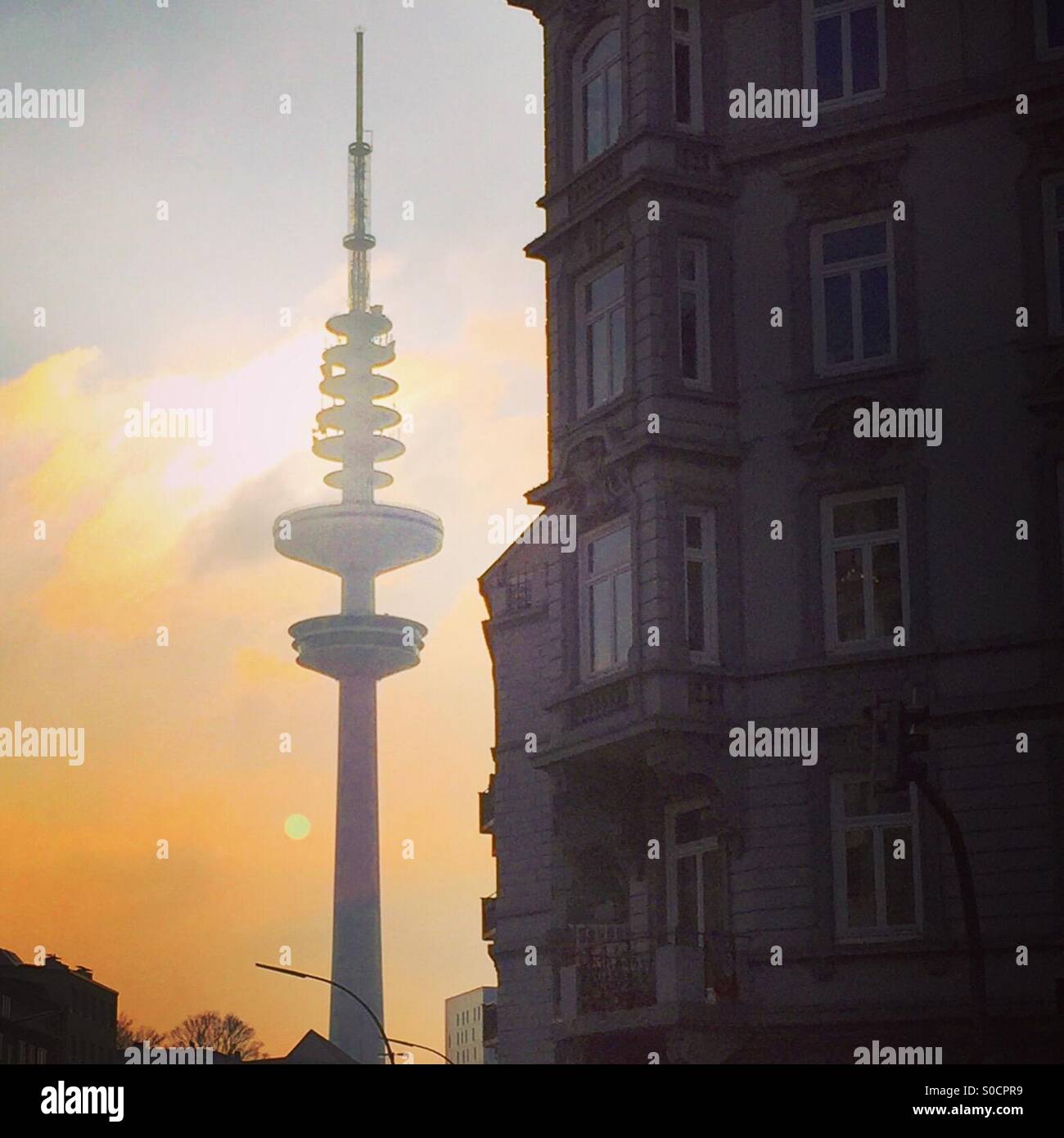 Sun setting behind Hamburg's TV tower Stock Photo