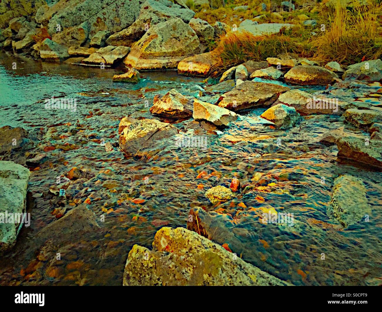 Rocky river in the sunsut Stock Photo