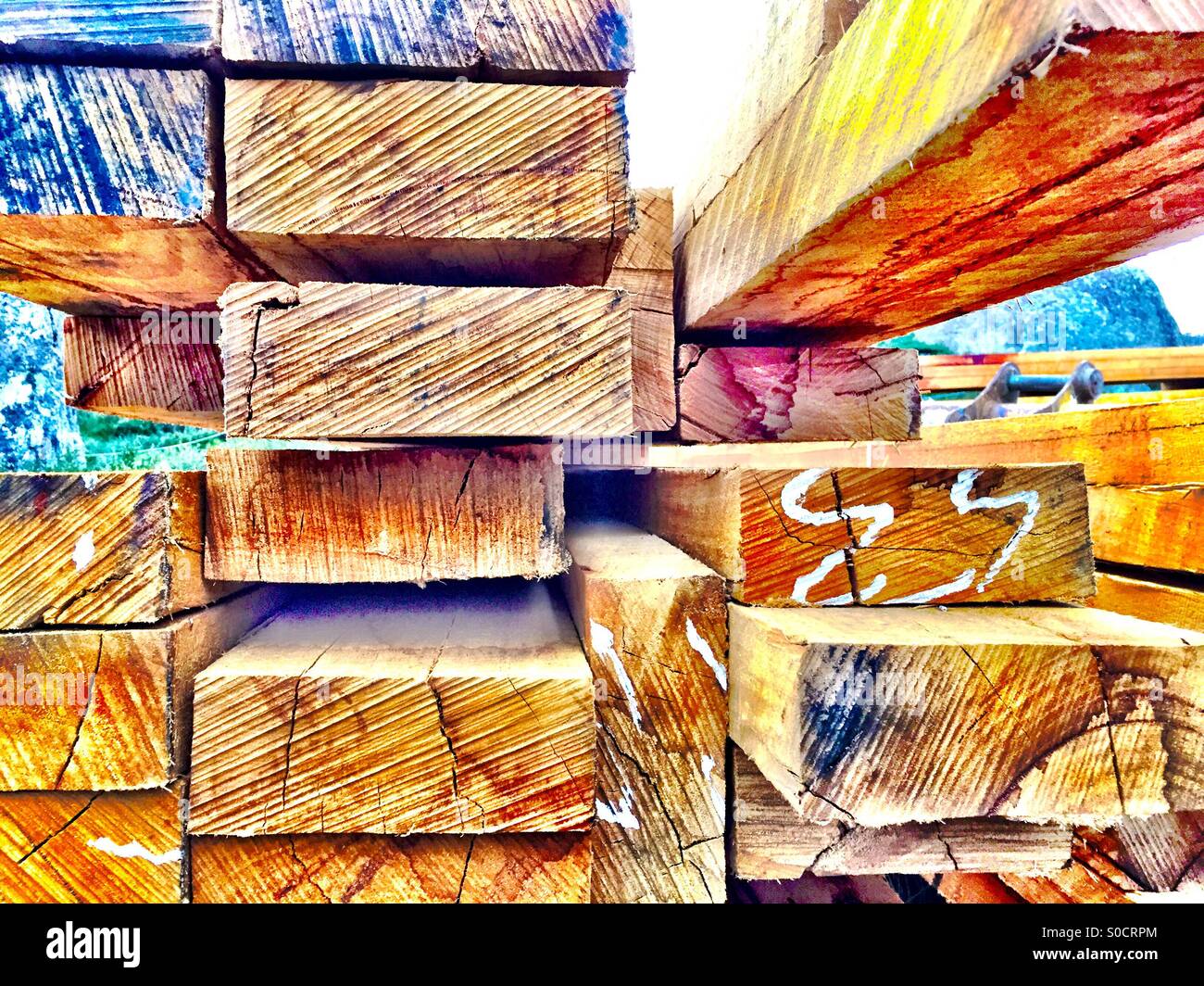 A pile of cut timber on a construction site Stock Photo