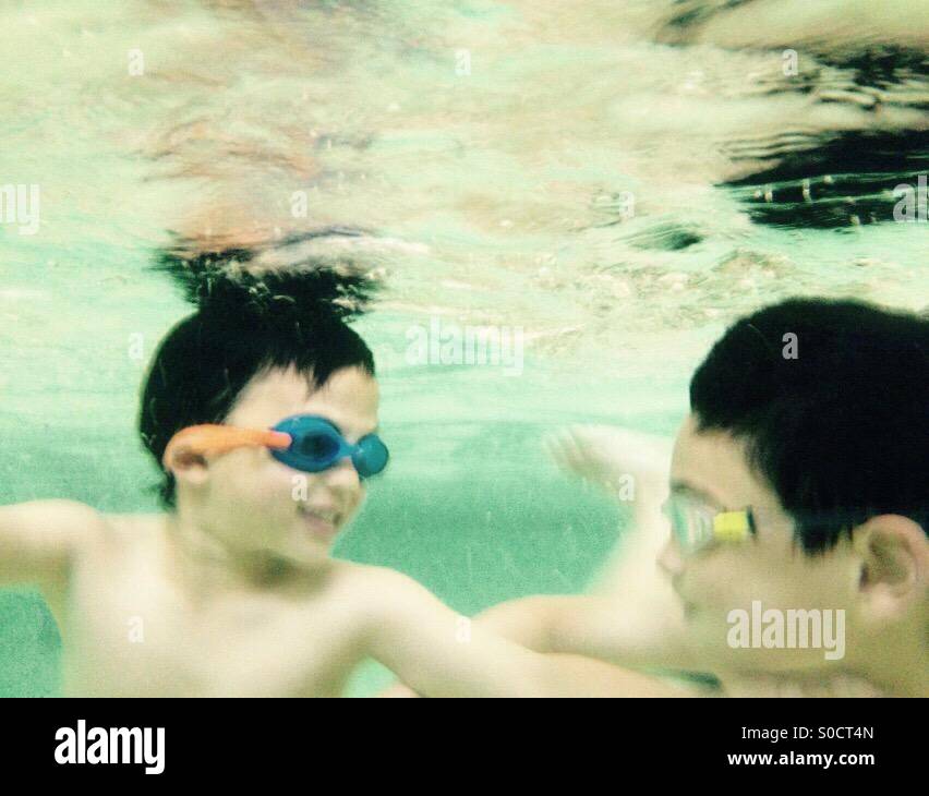Boys in swimming pool Stock Photo