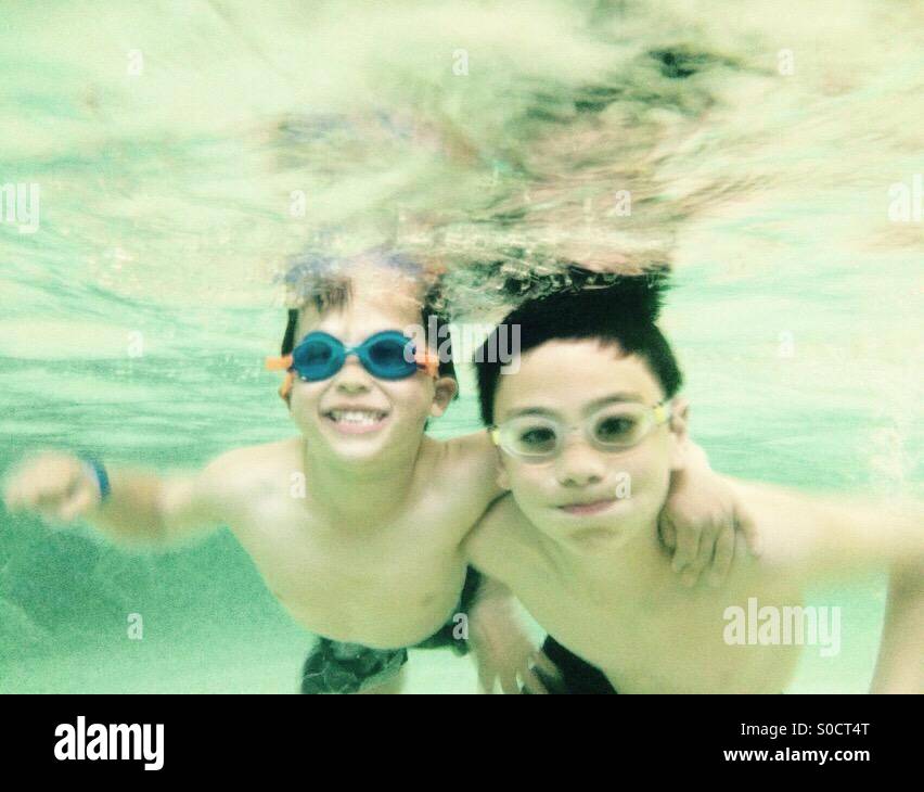 Boys in swimming pool Stock Photo