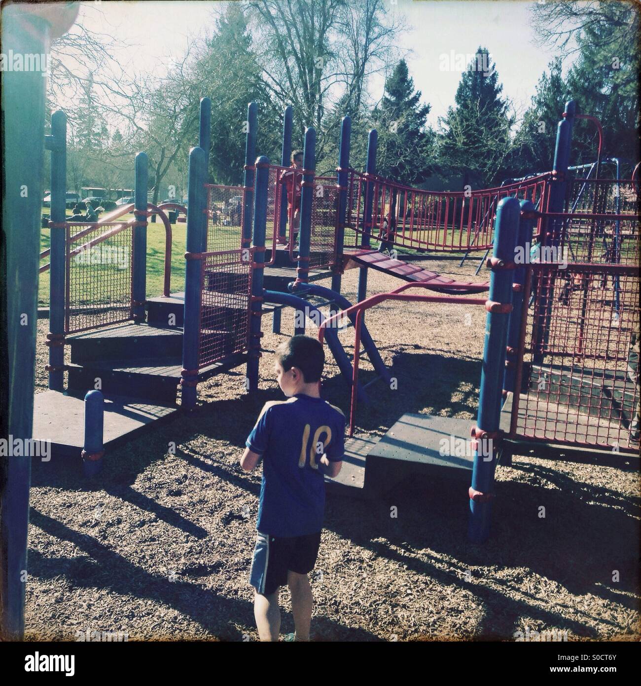 Boy playing on playground Stock Photo