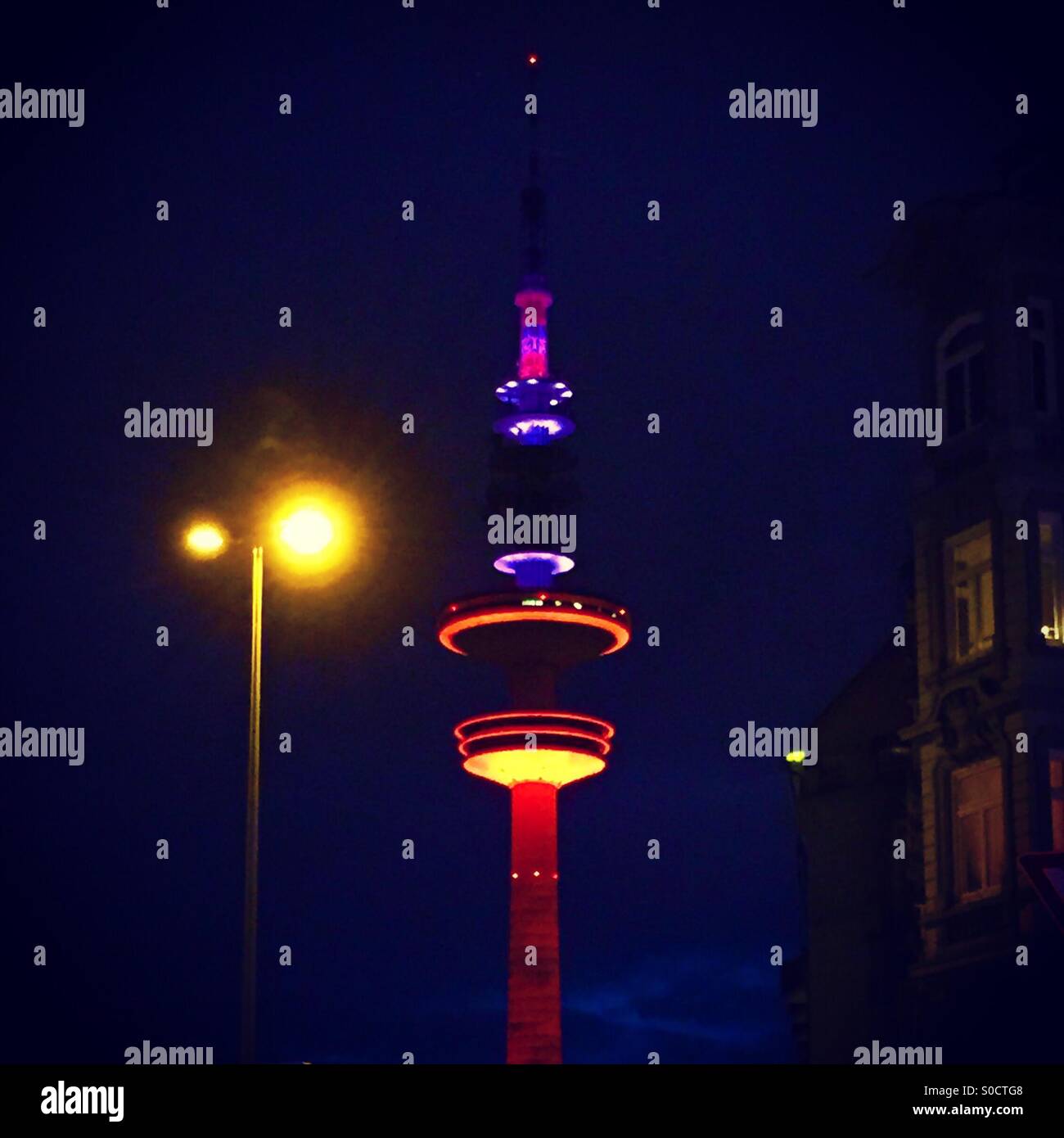 Hamburg's TV tower lit up at night Stock Photo