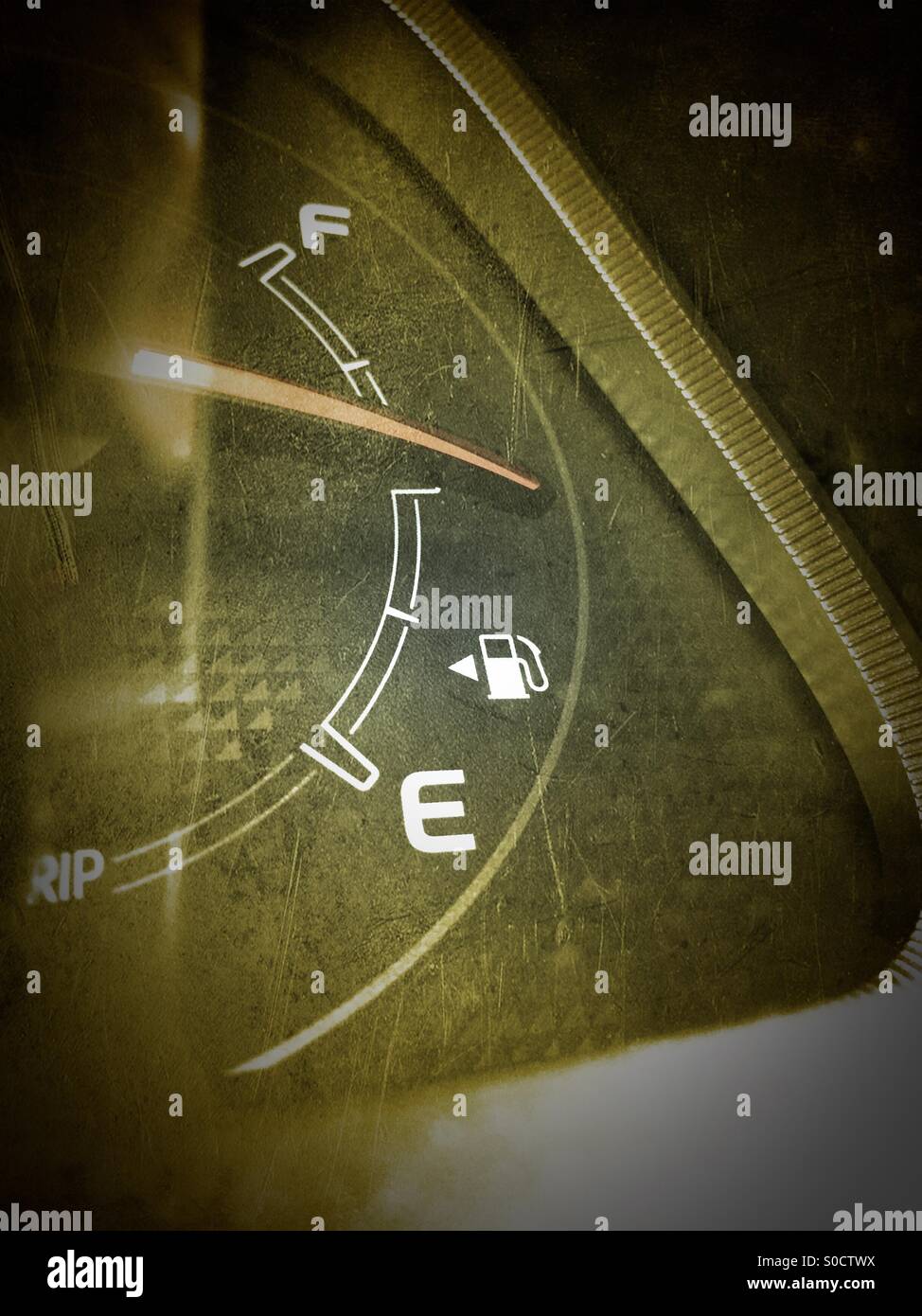 A fuel gauge on a car half full Stock Photo