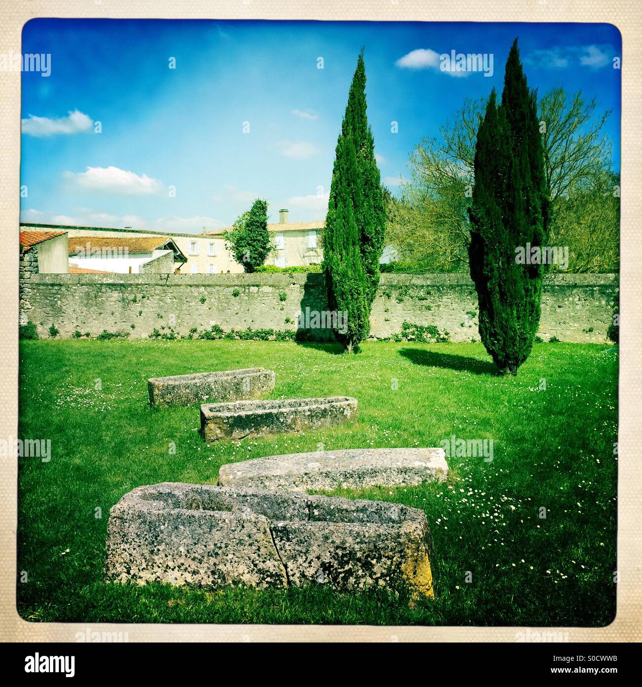 Stone coffins in the courtyard of a medieval church Stock Photo