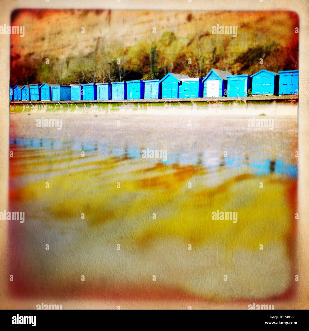 Blue beach huts with reflection Stock Photo