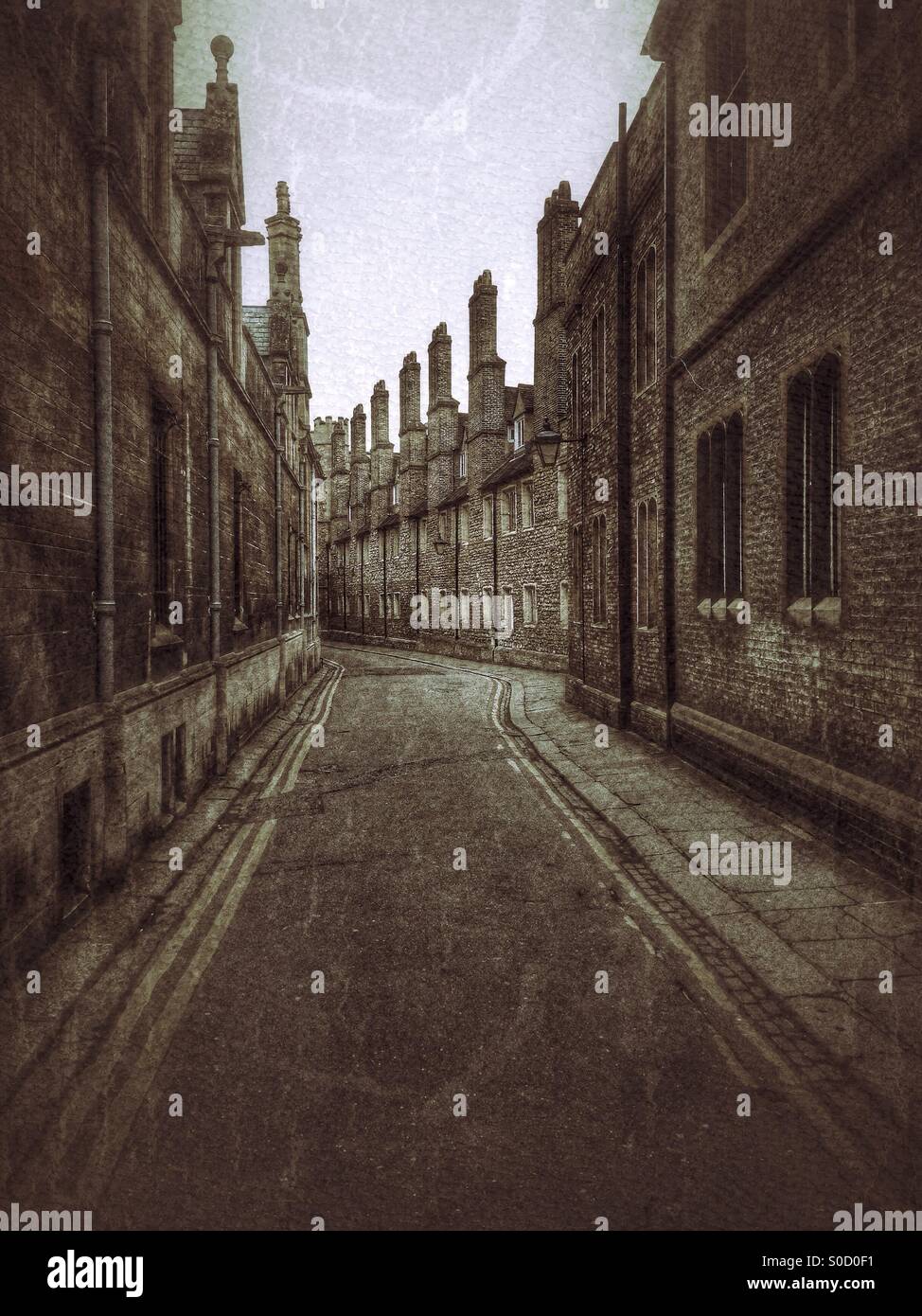Trinity Lane, Cambridge, England. A view looking West of a Historical Lane in the University area of Cambridge. The walls of Trinity College are to the Right. Gonville & Caius College Walls are Left. - Smartphone Captured Stock Image