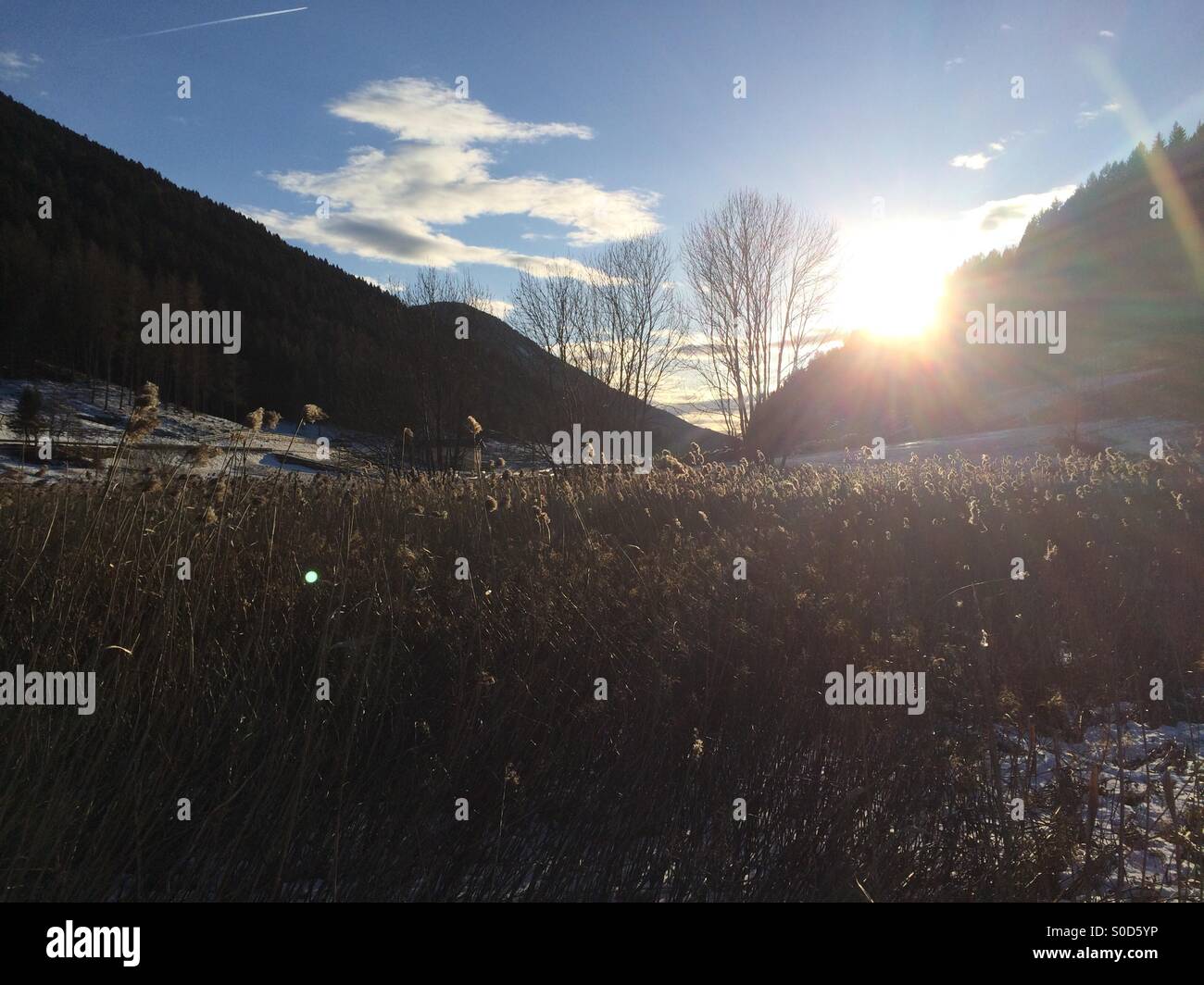 Sunlight over a snowy mountain landscape - Smartphone Captured Stock Image