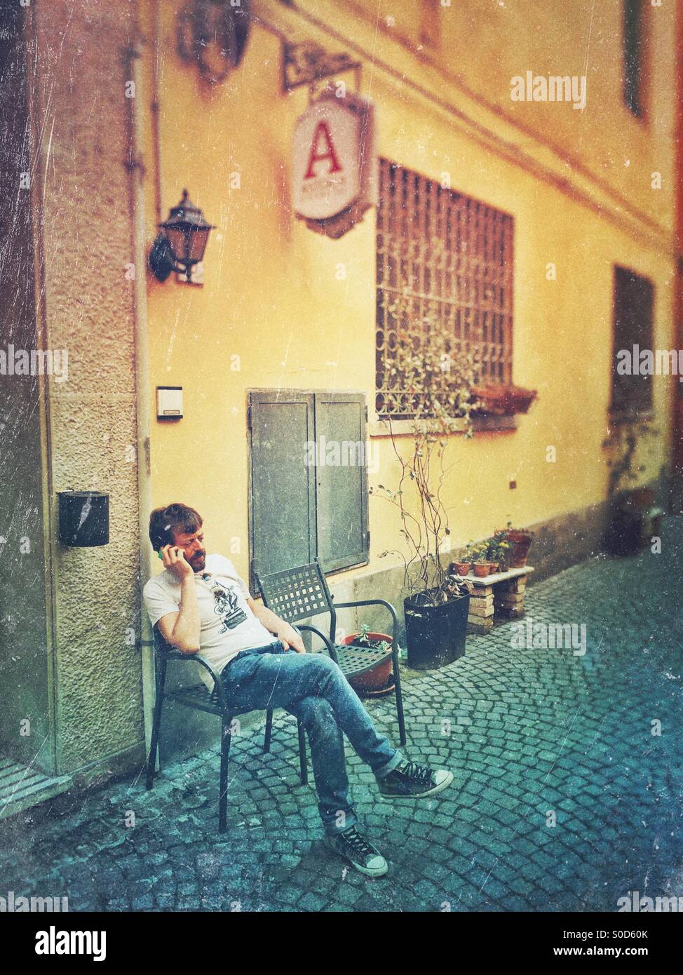 Street scene man at smartphone - Smartphone Captured Stock Image