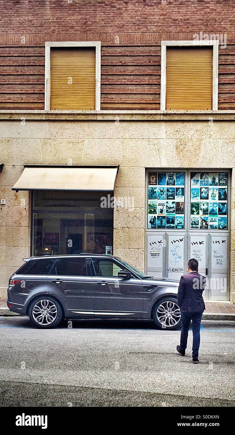 Man approaching his luxury suv - Smartphone Captured Stock Image