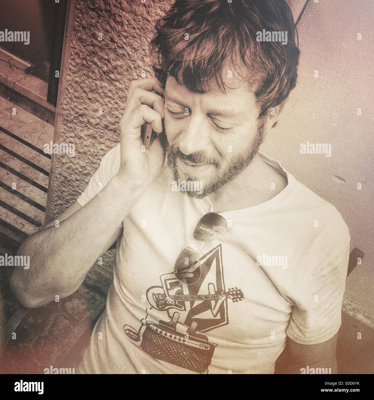 Calling his daughter - Smartphone Captured Stock Image