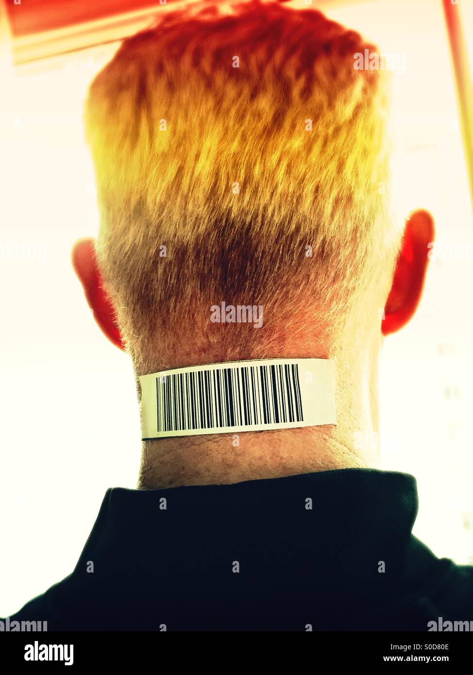 Senior man with bar code on neck - Smartphone Captured Stock Image