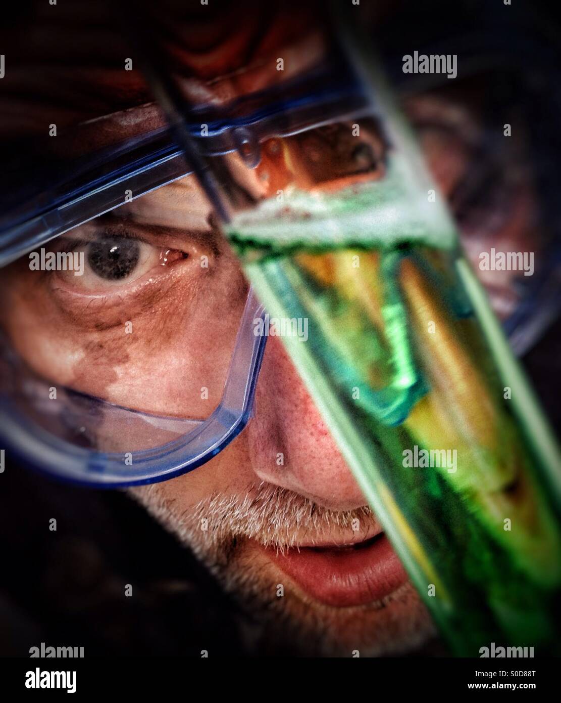 Scientist inspecting reaction in test tube - Smartphone Captured Stock Image