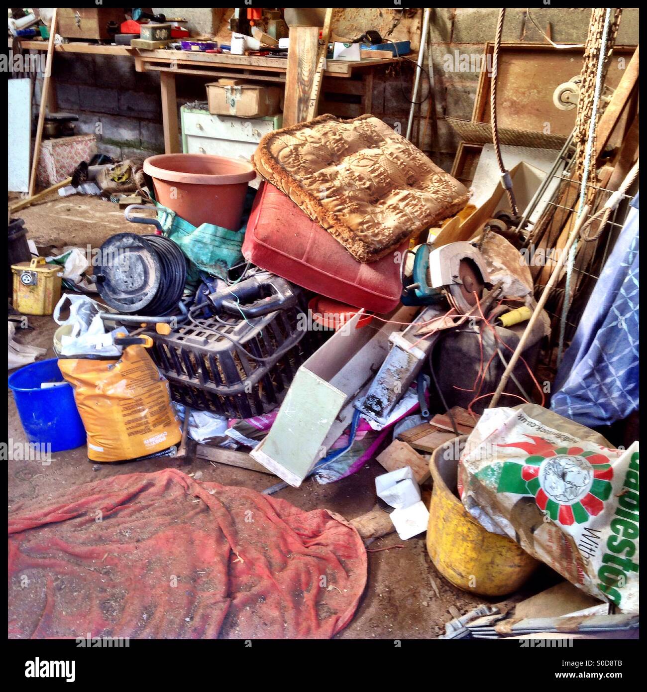 Pile of junk in large shed Stock Photo Alamy