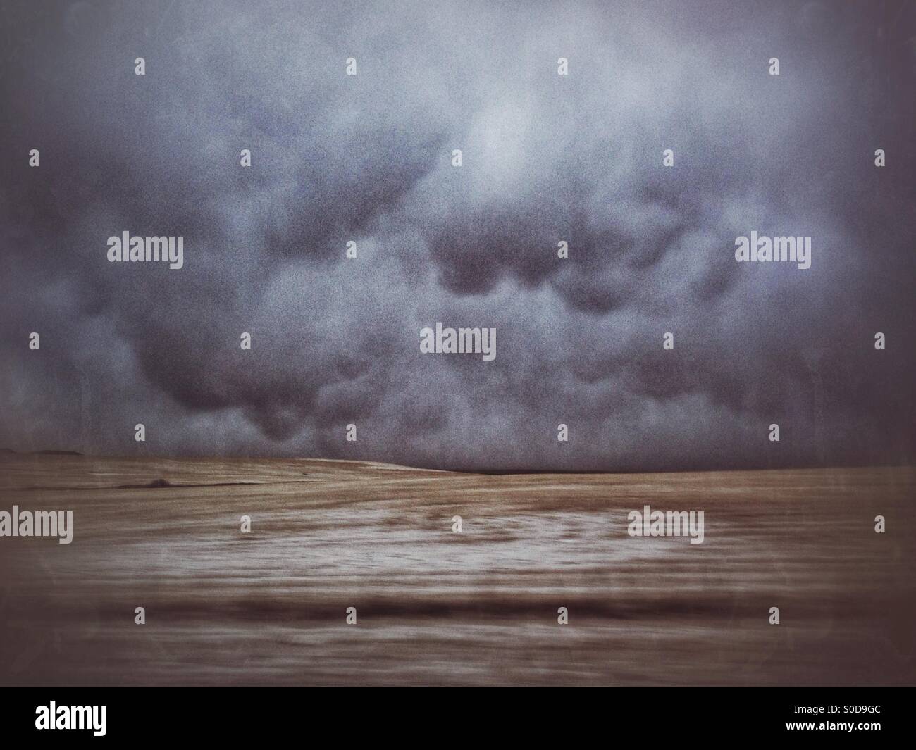 Driving along the edge of a snowstorm, in the prairies of Alberta, Canada. Taken along Highway 1, SE of Calgary. - Smartphone Captured Stock Image