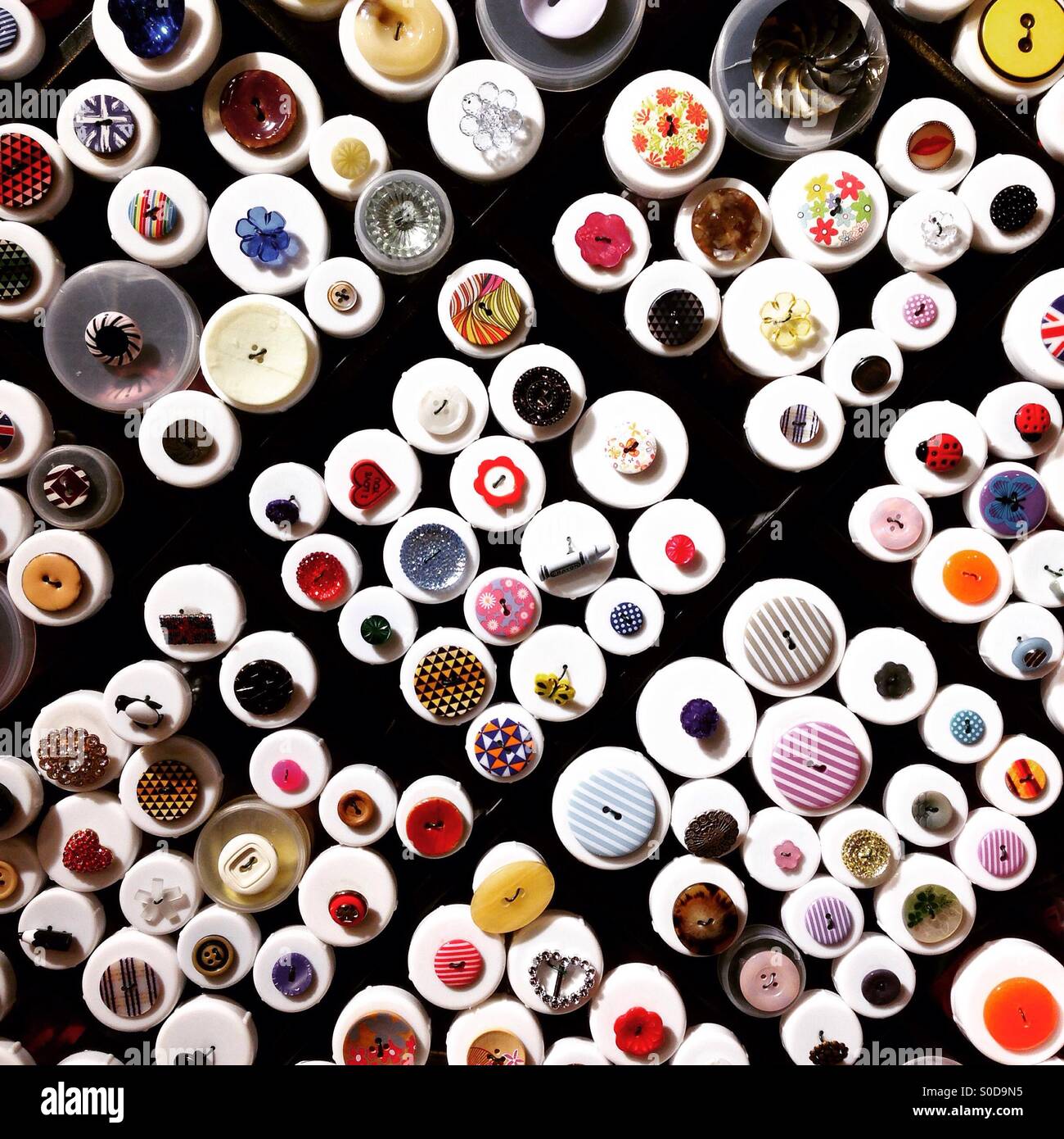 Many buttons at haberdasher retail background pattern Stock Photo Alamy