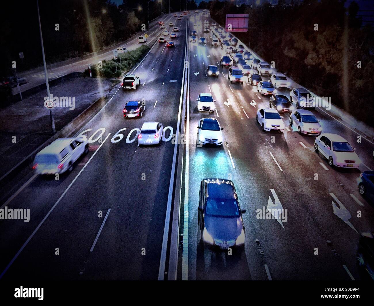 Cars at night on a busy freeway Stock Photo