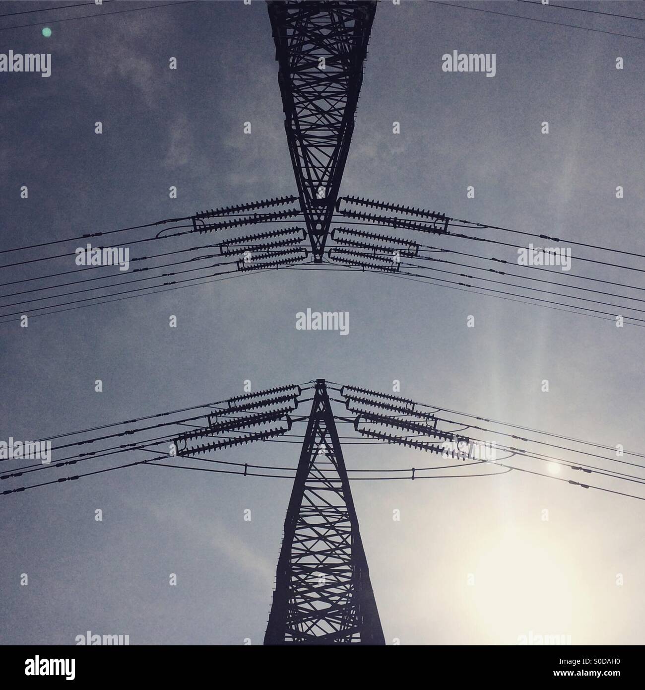 Power lines under a grey sky - Smartphone Captured Stock Image