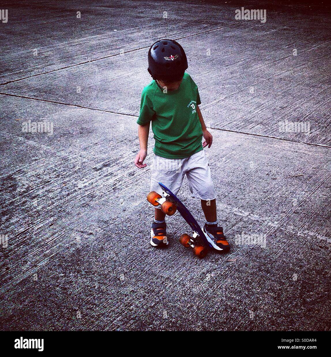 Little skater on the playground Stock Photo