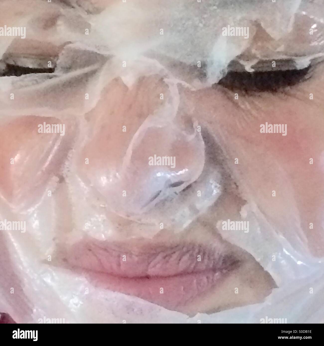 Woman removing mask cosmetic hi-res stock photography and images - Alamy
