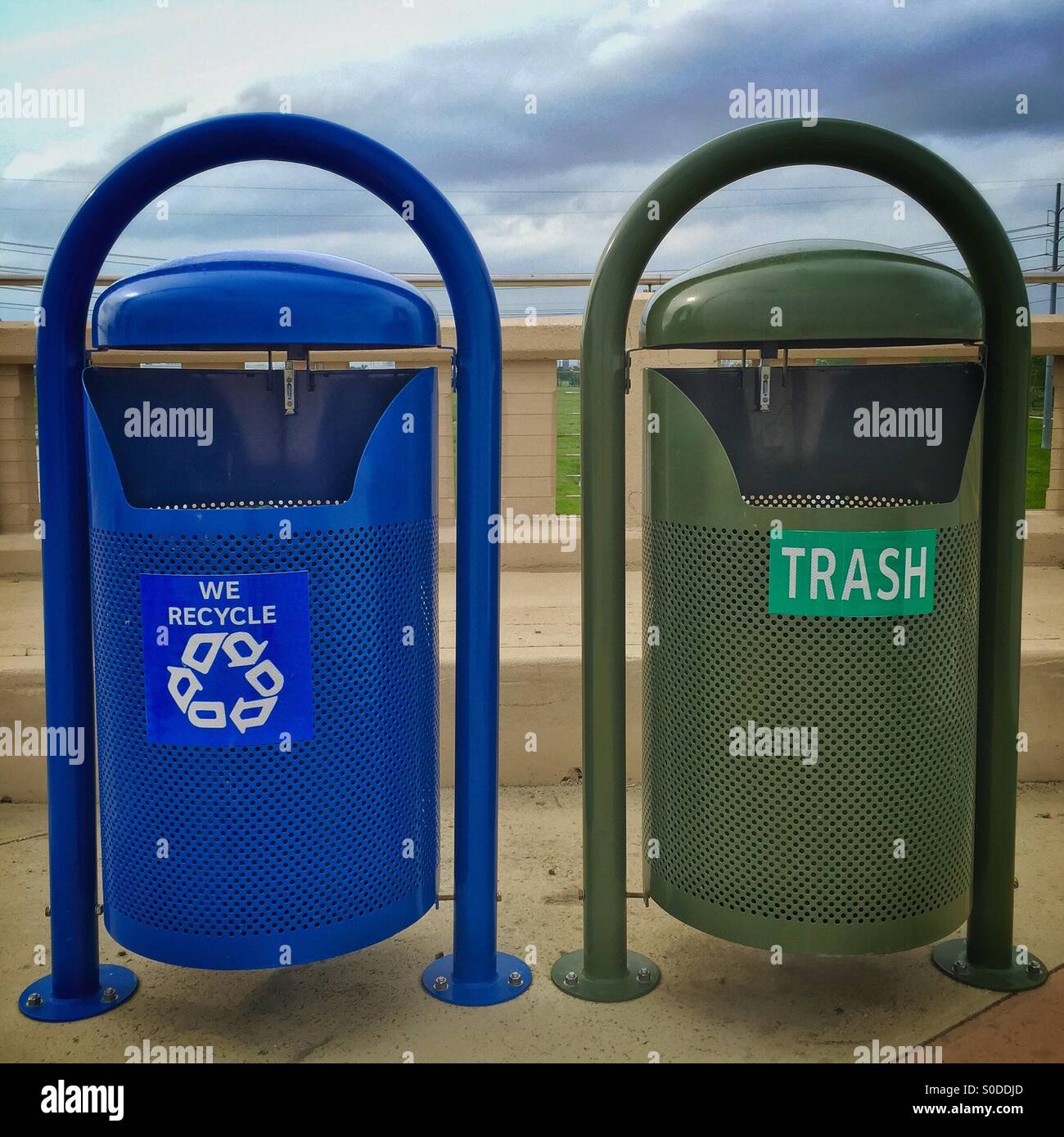 Earth Day! Recycle! A trash bin and a recycling bin side by side in