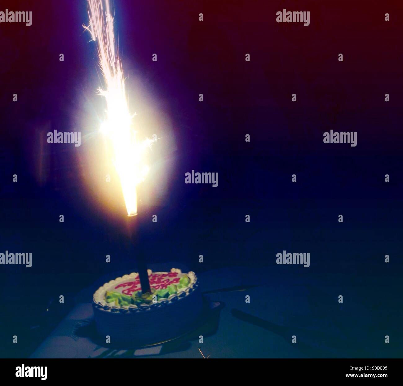 Birthday cake with spark candle Stock Photo Alamy