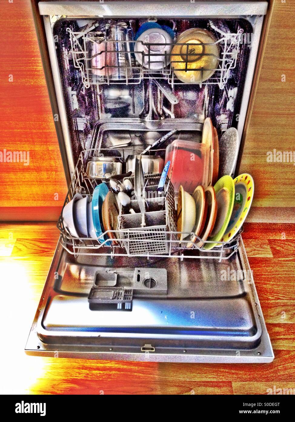 A loaded dishwasher. Stock Photo