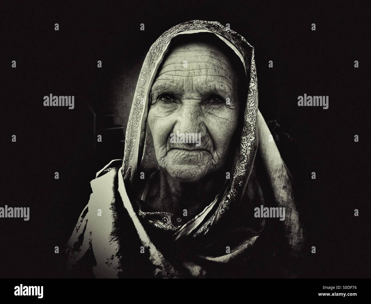 Portrait of an old woman in Kharian village Pakistan - Smartphone Captured Stock Image