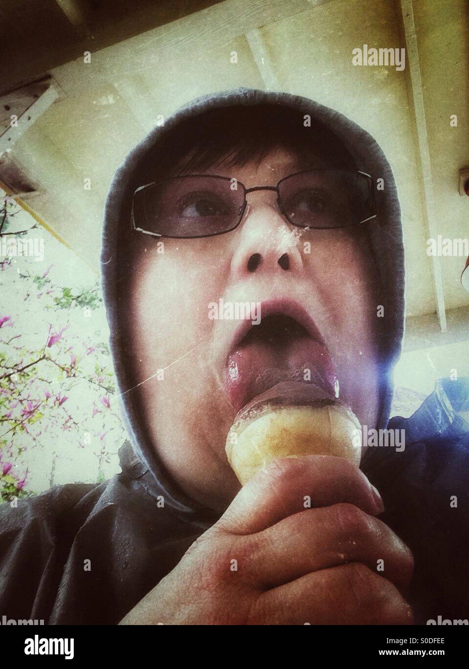 Eating ice cream on a rainy day. - Smartphone Captured Stock Image