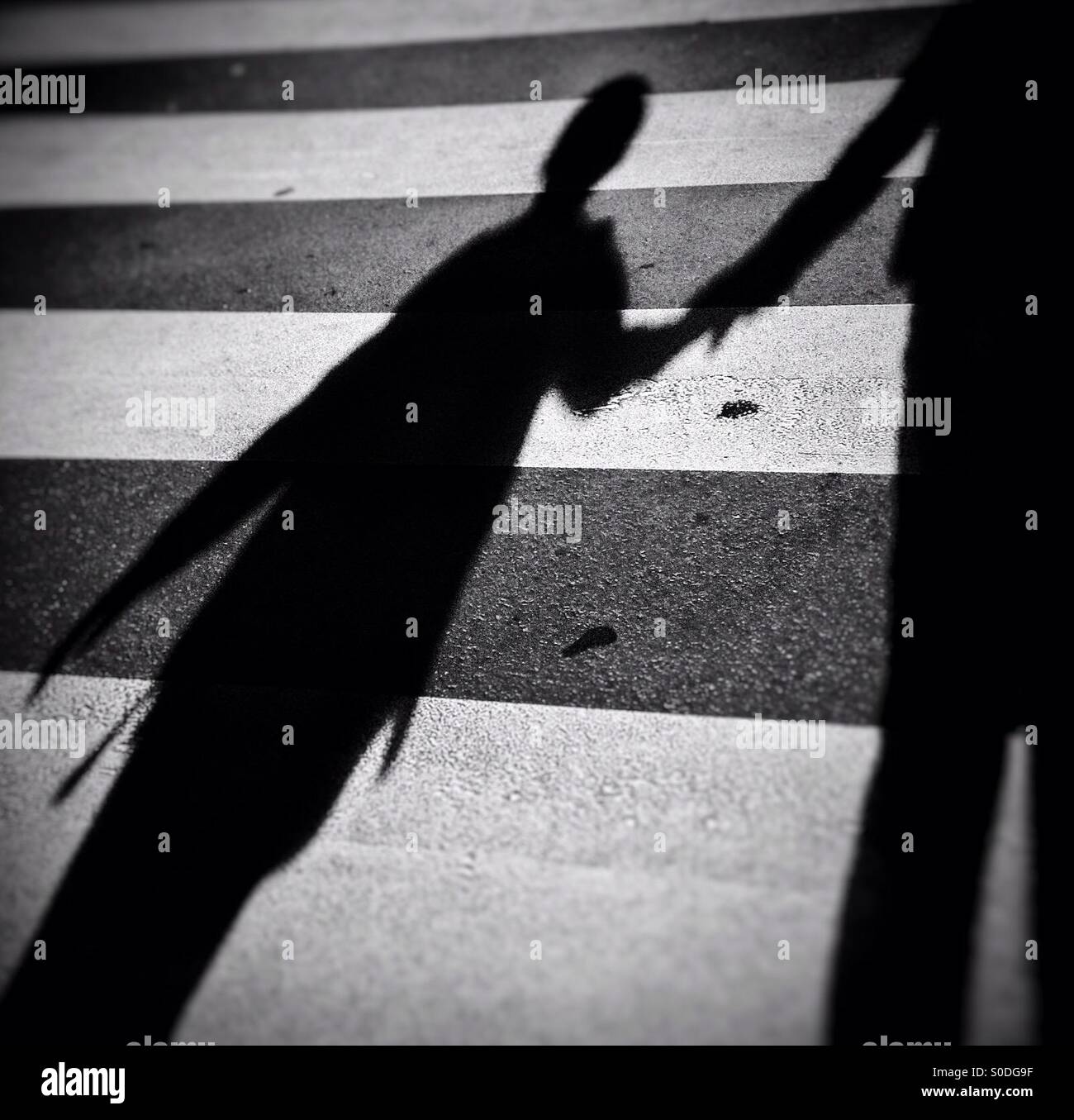 Child and his mother crossing a pedestrian crossing - Smartphone Captured Stock Image