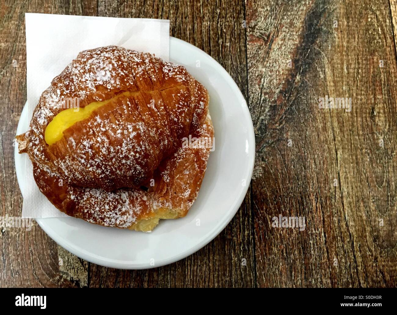 Morning breakfast with a creamy croissant - Smartphone Captured Stock Image