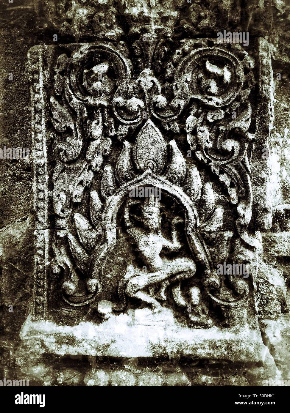 Ancient carving on a pillar at Ta Phrom Temple Cambodia Stock Photo