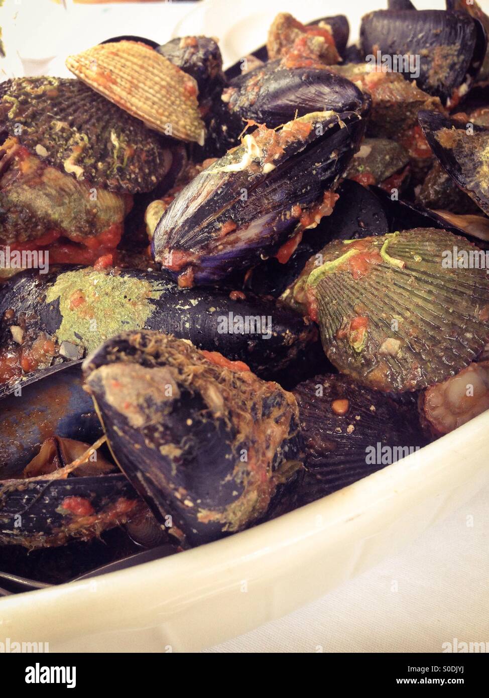 Cooked shellfish in tomato sauce Stock Photo Alamy