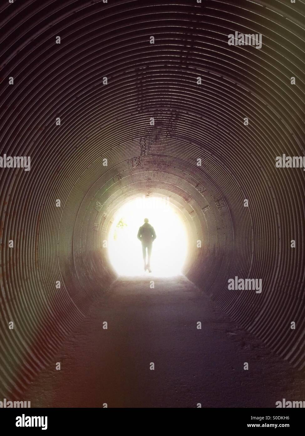 Man exiting tunnel - Smartphone Captured Stock Image