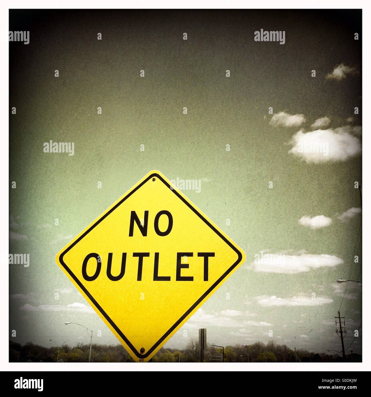 No Outlet sign against an ominous gray sky Stock Photo