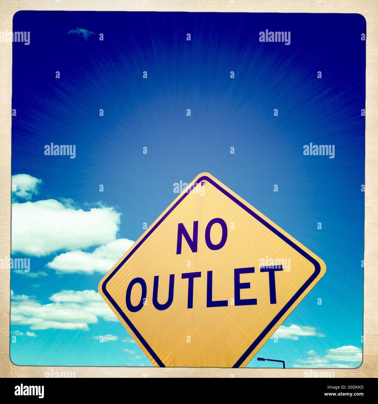 No Outlet street sign against a blue sky - Smartphone Captured Stock Image