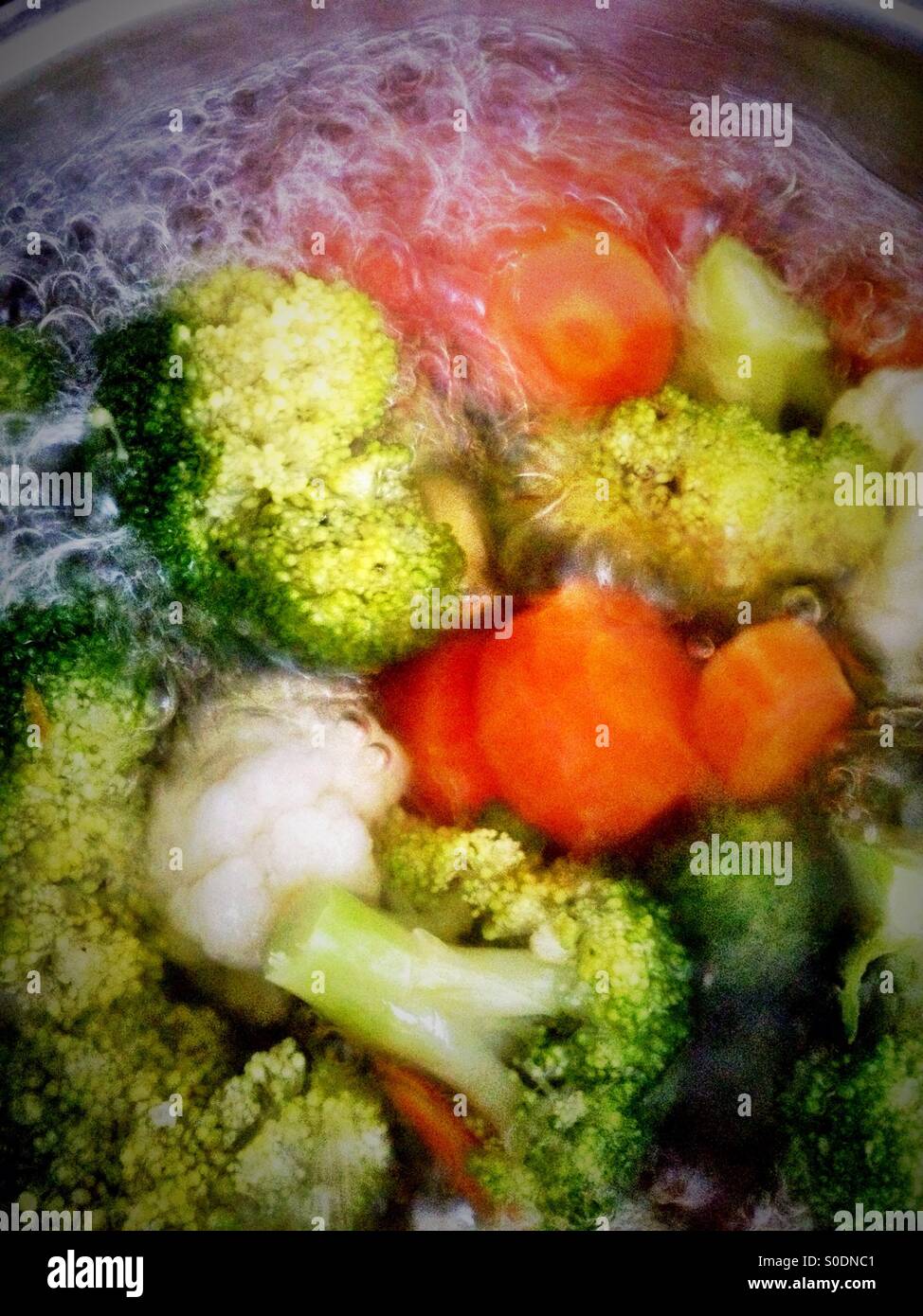 Boiling mixed vegetables in a pan. - Smartphone Captured Stock Image