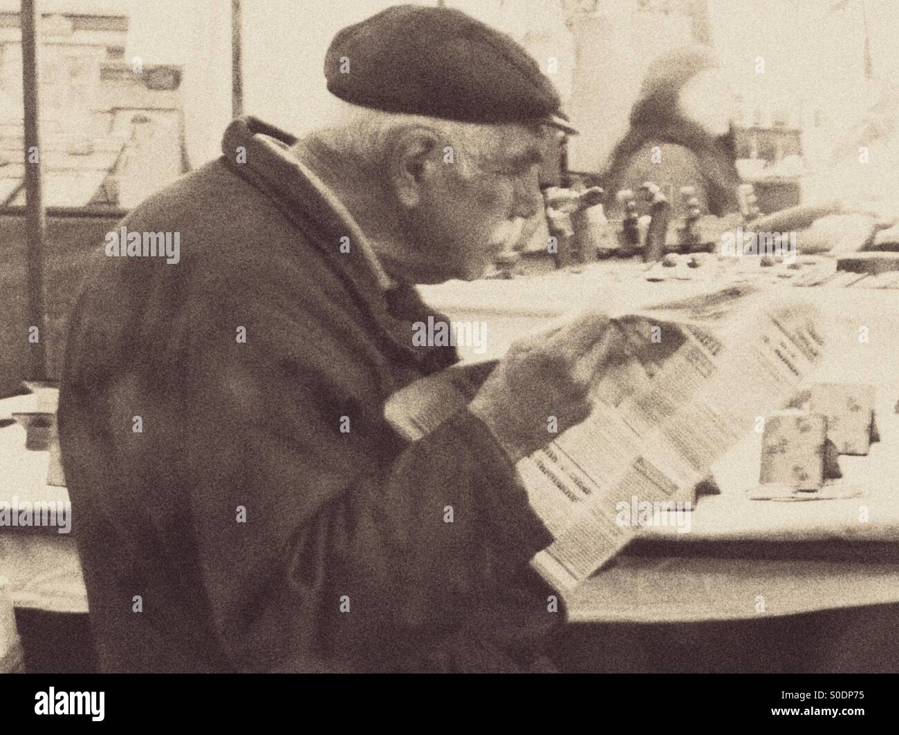 Old man reading the newspaper - Smartphone Captured Stock Image